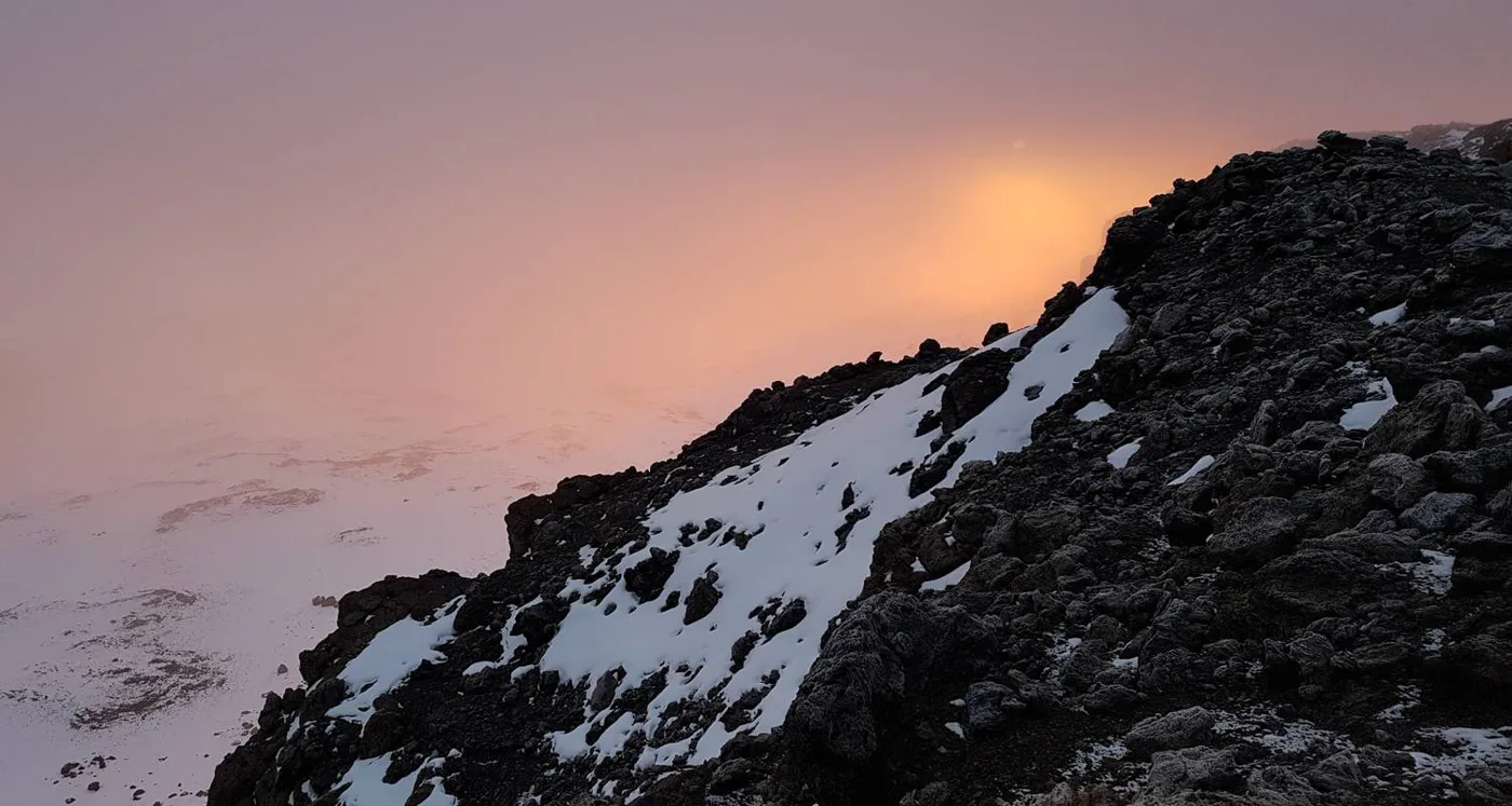 Snow and rock on Kilimanjaro at sunset