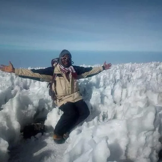 Climber beside ice on Kilimanjaro